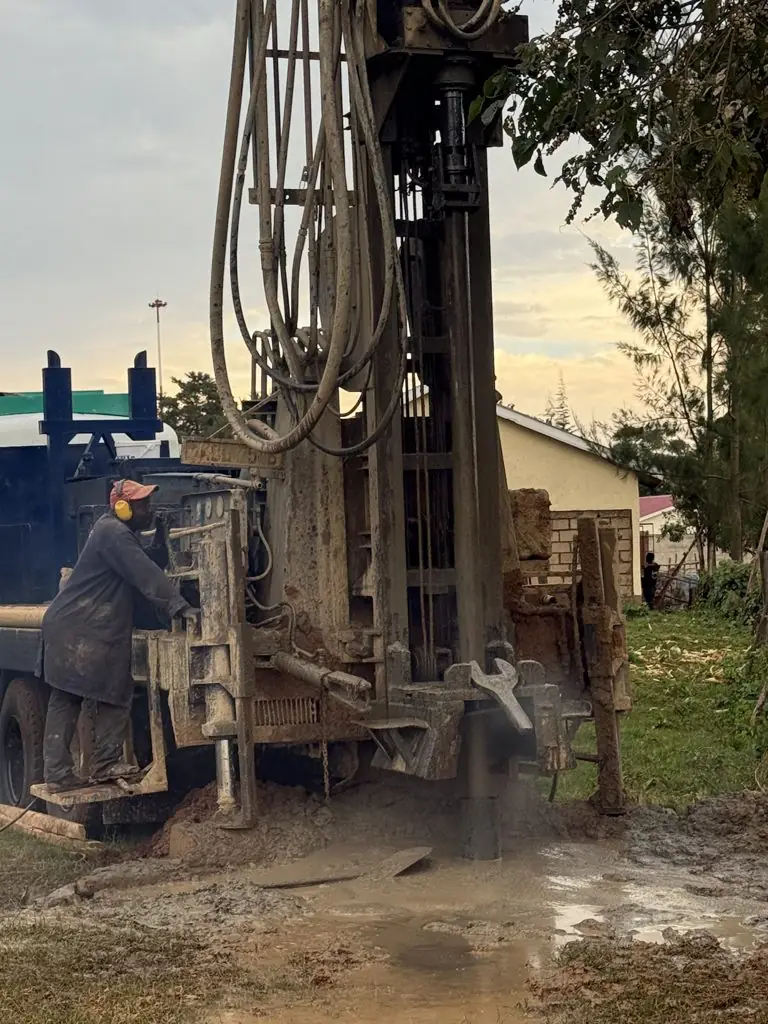 Operator at the controls of the drilling rig at Elgon Estate, Turbo