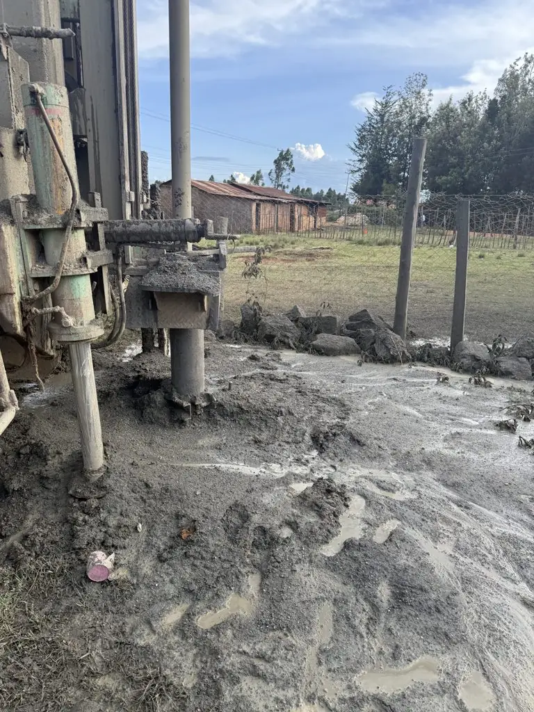 Drill string and wet cuttings at the borehole, Kaptinga Milk Plant